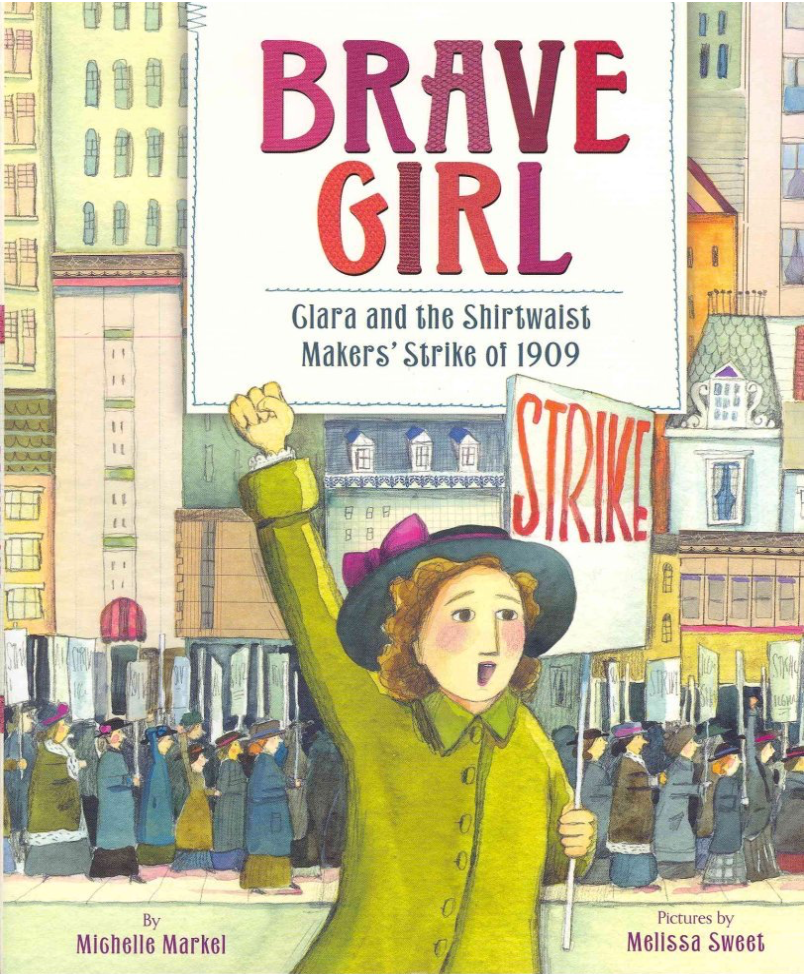 Images shows the cover of the book, Brave Girl: Clara and the Shirtwaist Makers' Strike of 1909, written by Michelle Markel and illustrated by Melissa Sweet. The picture shows a young girl holding a sign that says Strike. Behind here is a tall building and several other women picketing. 